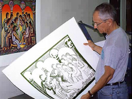 John August Swanson examining serigraph proof of Washing of the Feet John August Swanson examining serigraph proof of Washing of the Feet